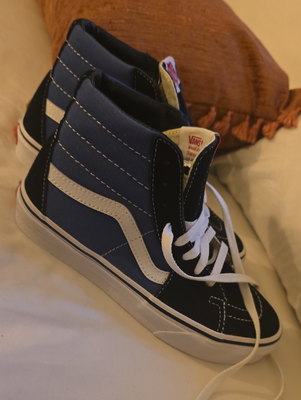 Navy and black Vans Sk8-Hi high-top skate shoes with white side stripe